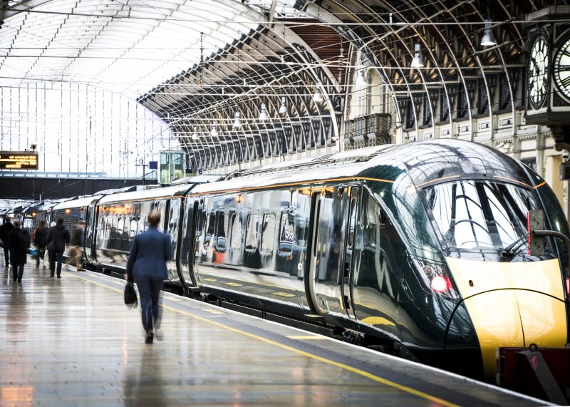Modern fast intercity train parked at station, ready for passengers to alight